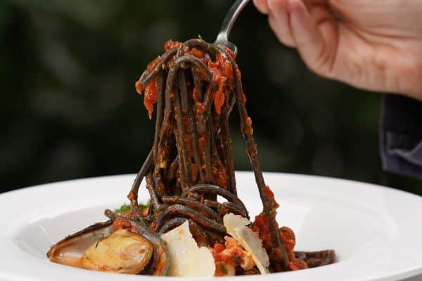 In Sicily, you must try a bowl of Black Squid Ink Pasta, known locally as Spaghetti al nero di seppie