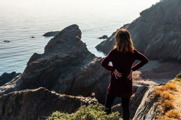 Woman pausing during a walk for a scenic overlook 