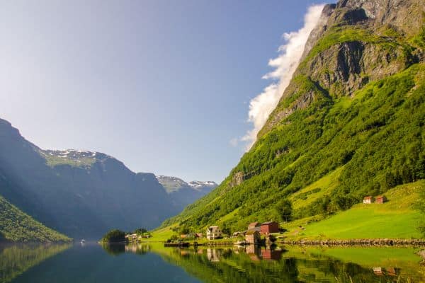 Views of Norway's scenic fjords, with a quiet village nestled into the side of a mountain
