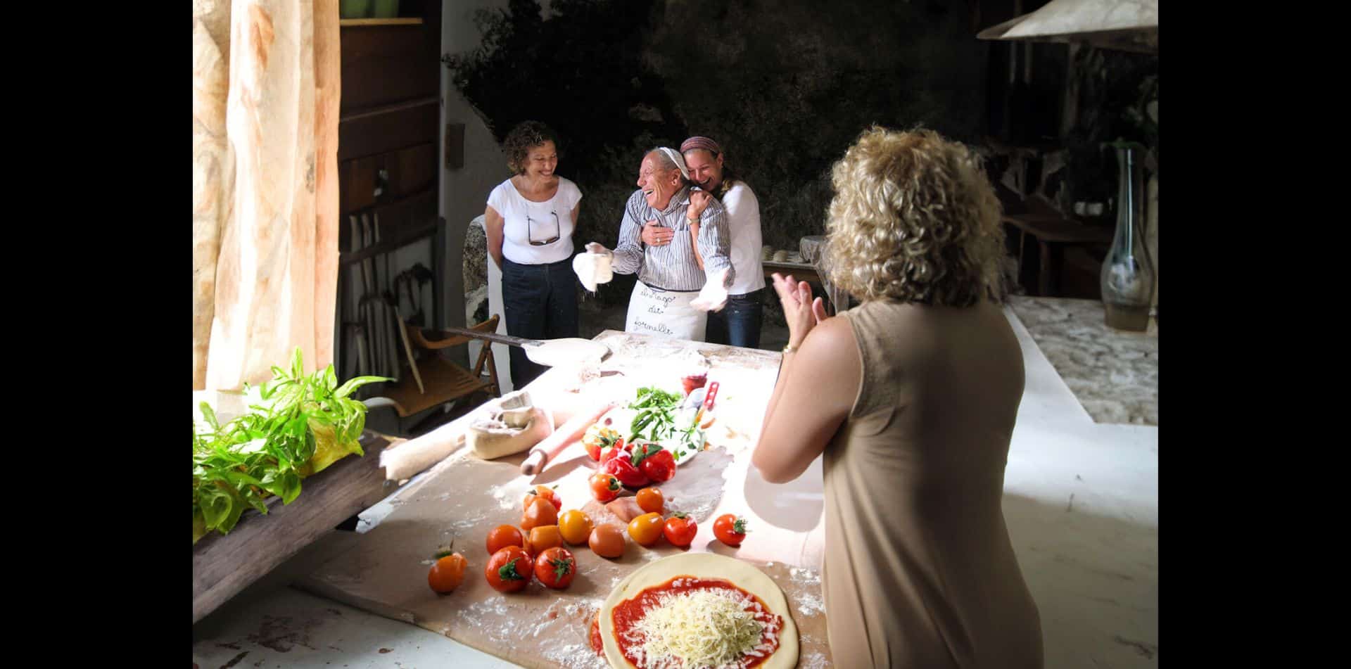 Food is a foolproof way into the hearts, homes and history of the places you visit with us, which you'll experience when making pizza with our local friends.