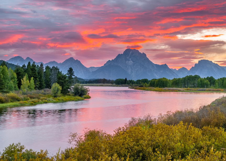 Sunset over Grand Tetons mountains and river from the Oxbow Bend Turnout