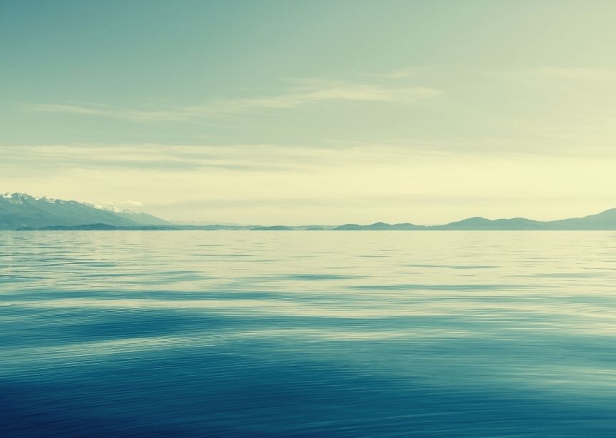 USA Flathead lake Montana blue water blending into mountains and sky