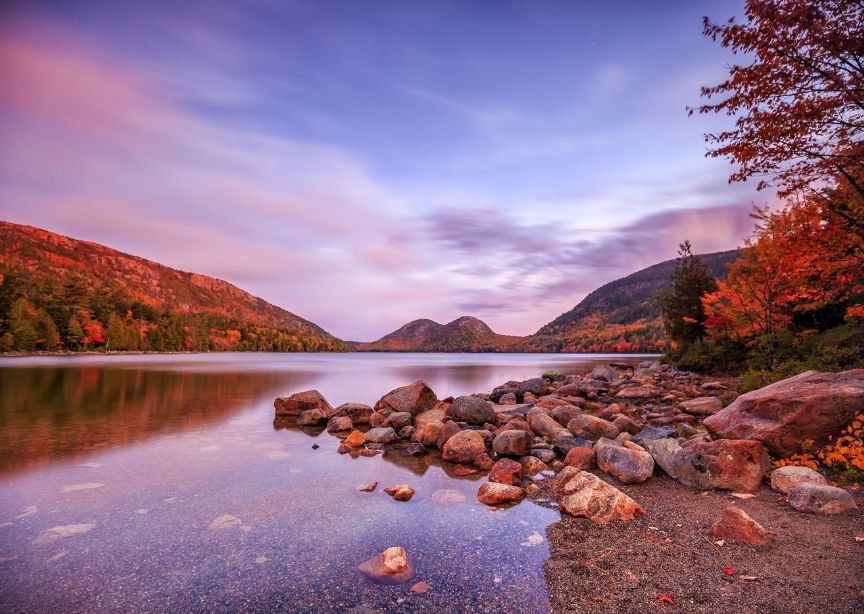 USA Maine Acadia National Park Mount Desert Island sunset lake, rocky shore and mountains