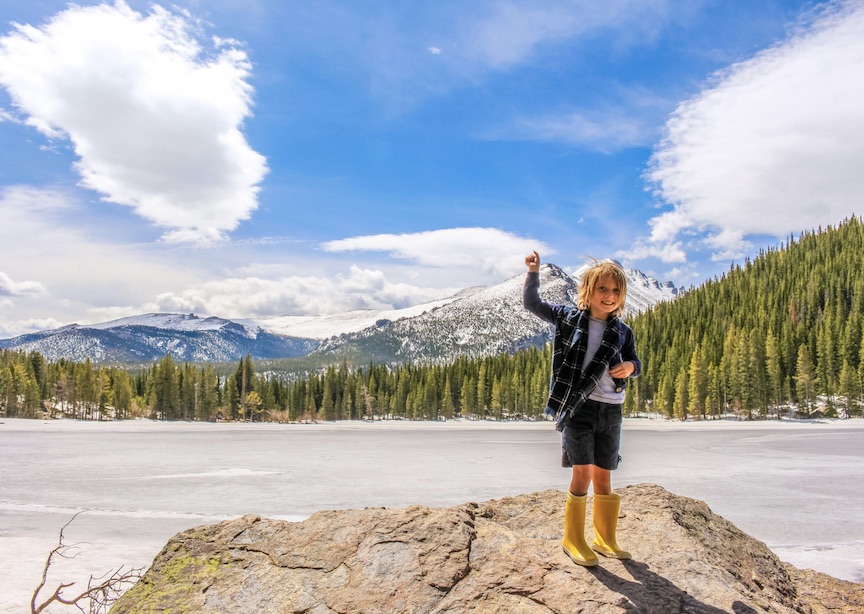 Happy child traveler on rocks in Canada