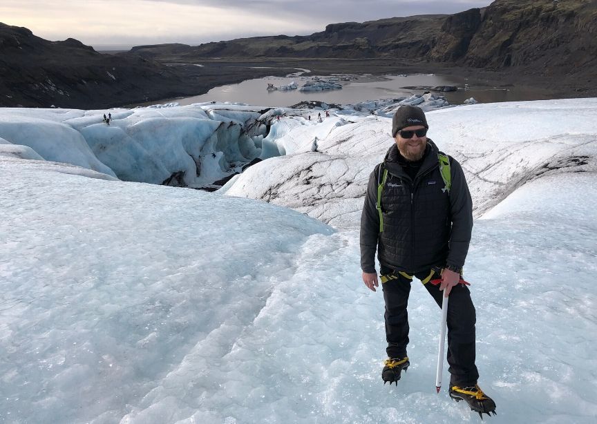 Iceland guide Alti standing on glacier