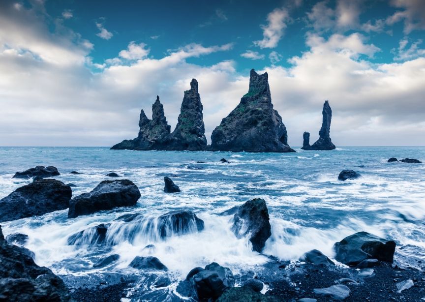 Iceland jagged rocks black sand beach