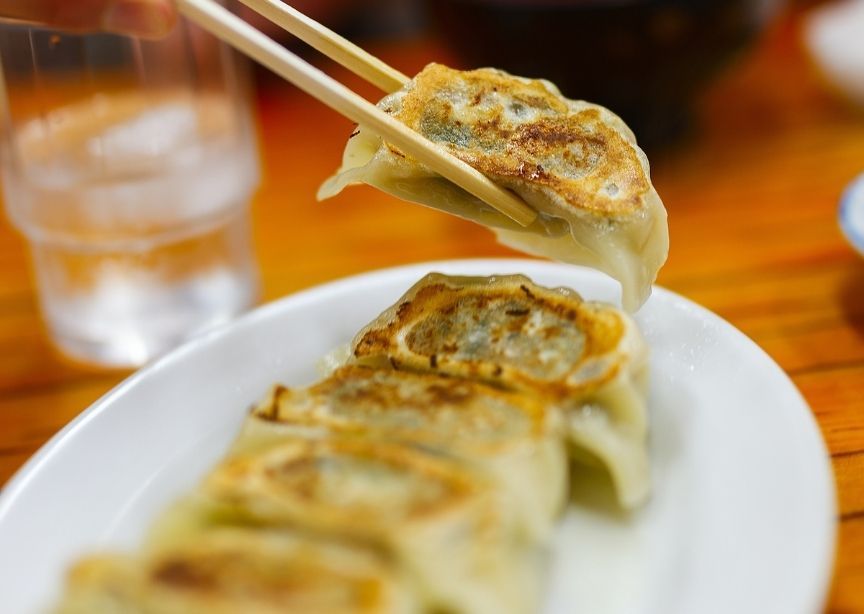 Asia Chinese ear shaped dumplings and chopsticks holiday tradition