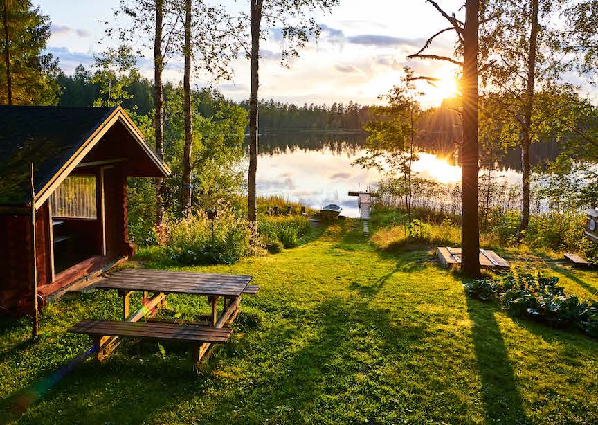 Finland green lakeside sauna