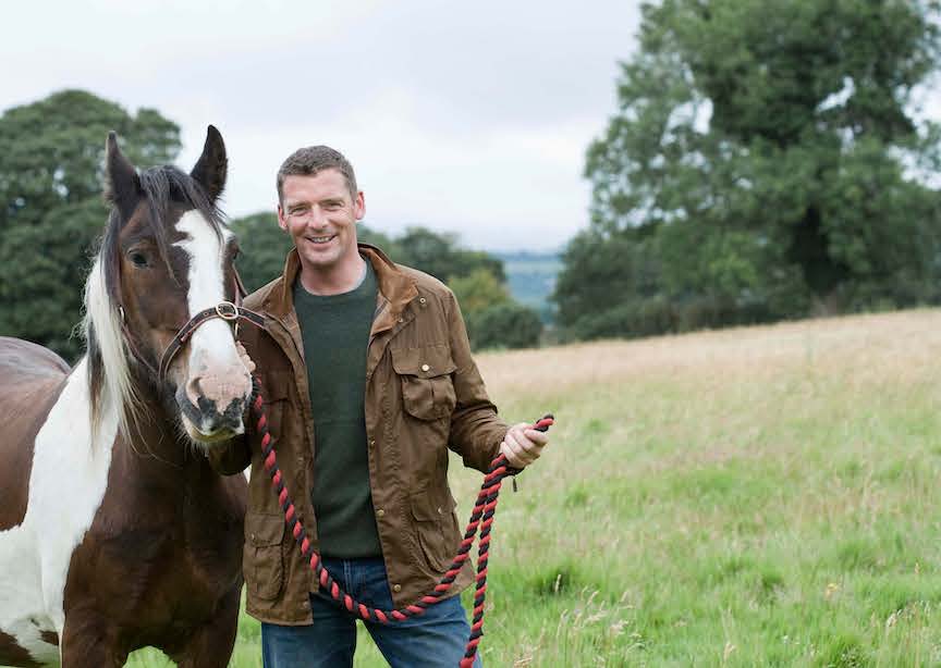 Ireland Irish man and horse in green field