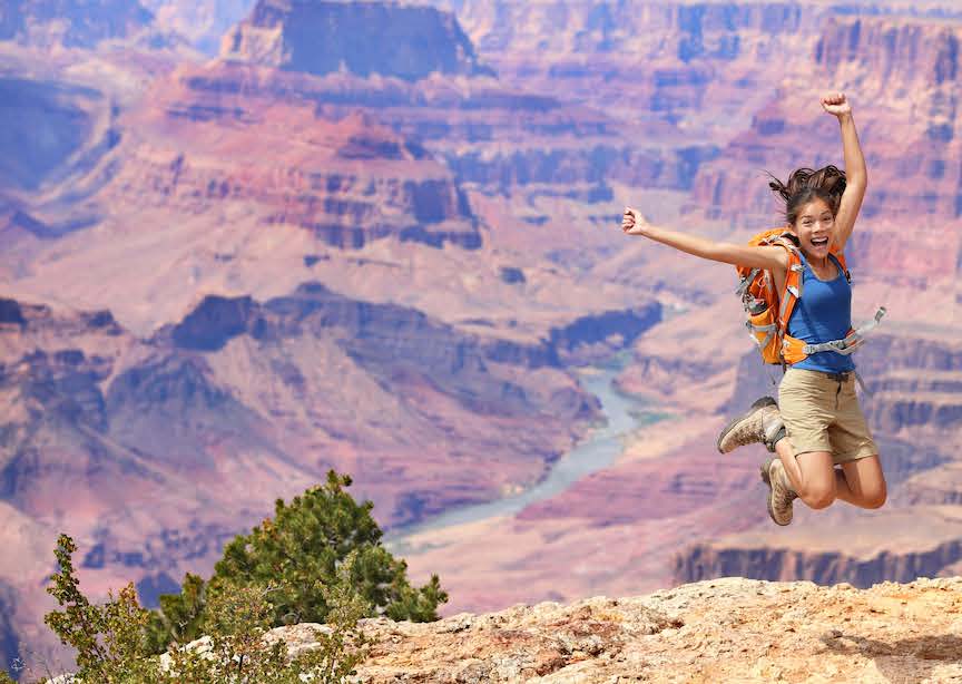 USA Grand Canyon happy traveler jumping 