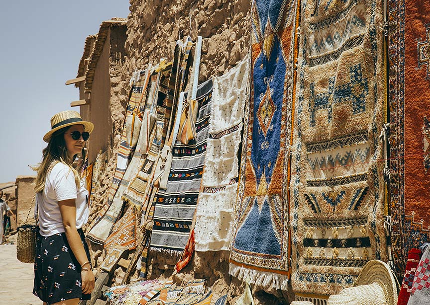 Morocco Marrakech market young teen girl shopping carpets